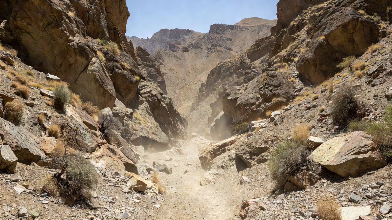 A narrow rocky mountain passage in a dry Central Asian landscape